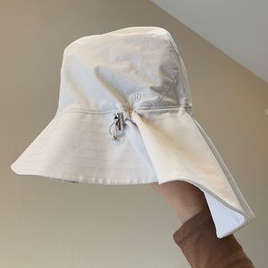 Lululemon Sun hat with adjustable strings size M in beige